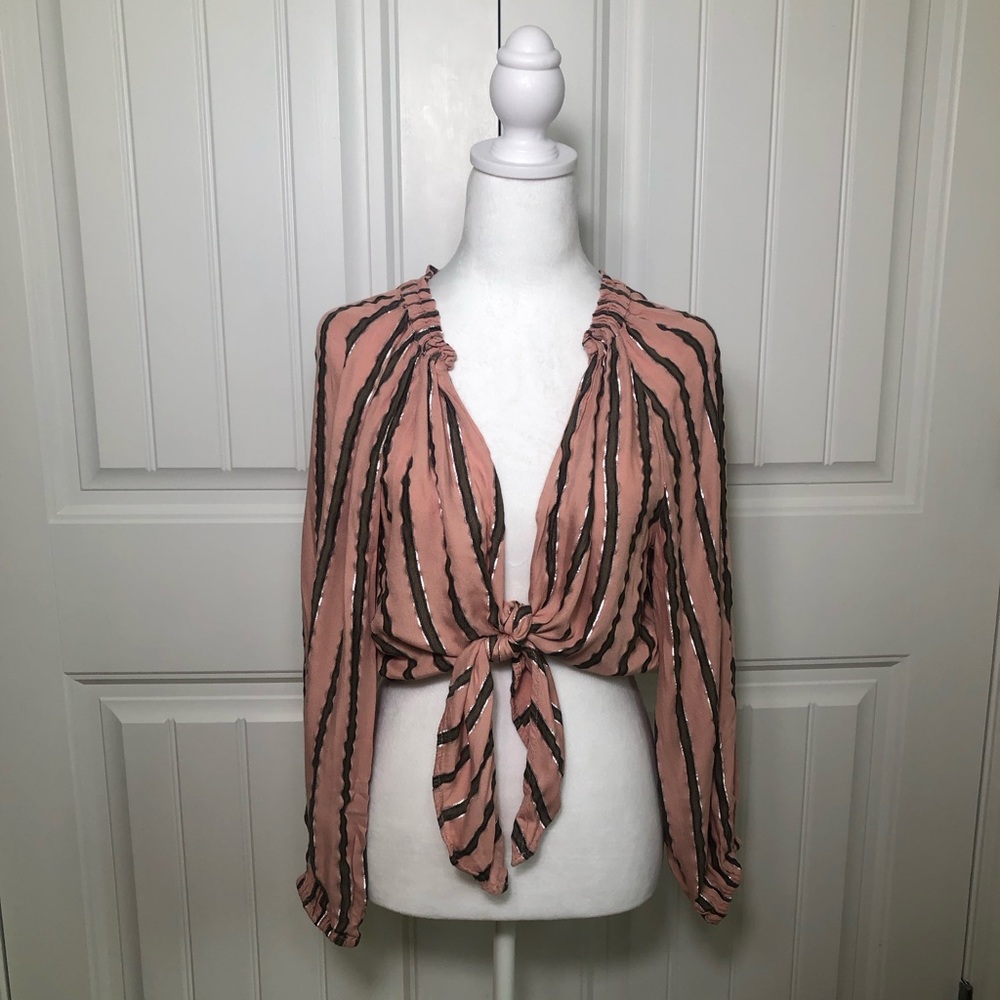 Womens long sleeve light weight open front blouse with a deep v neckline. Small